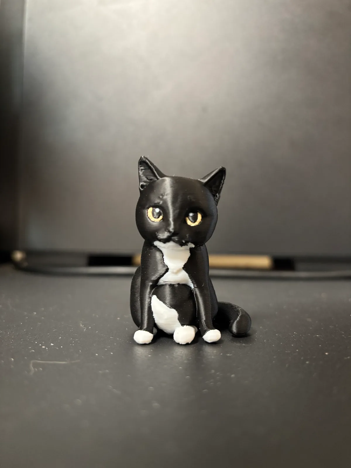Finished physical figurine of Momo sitting